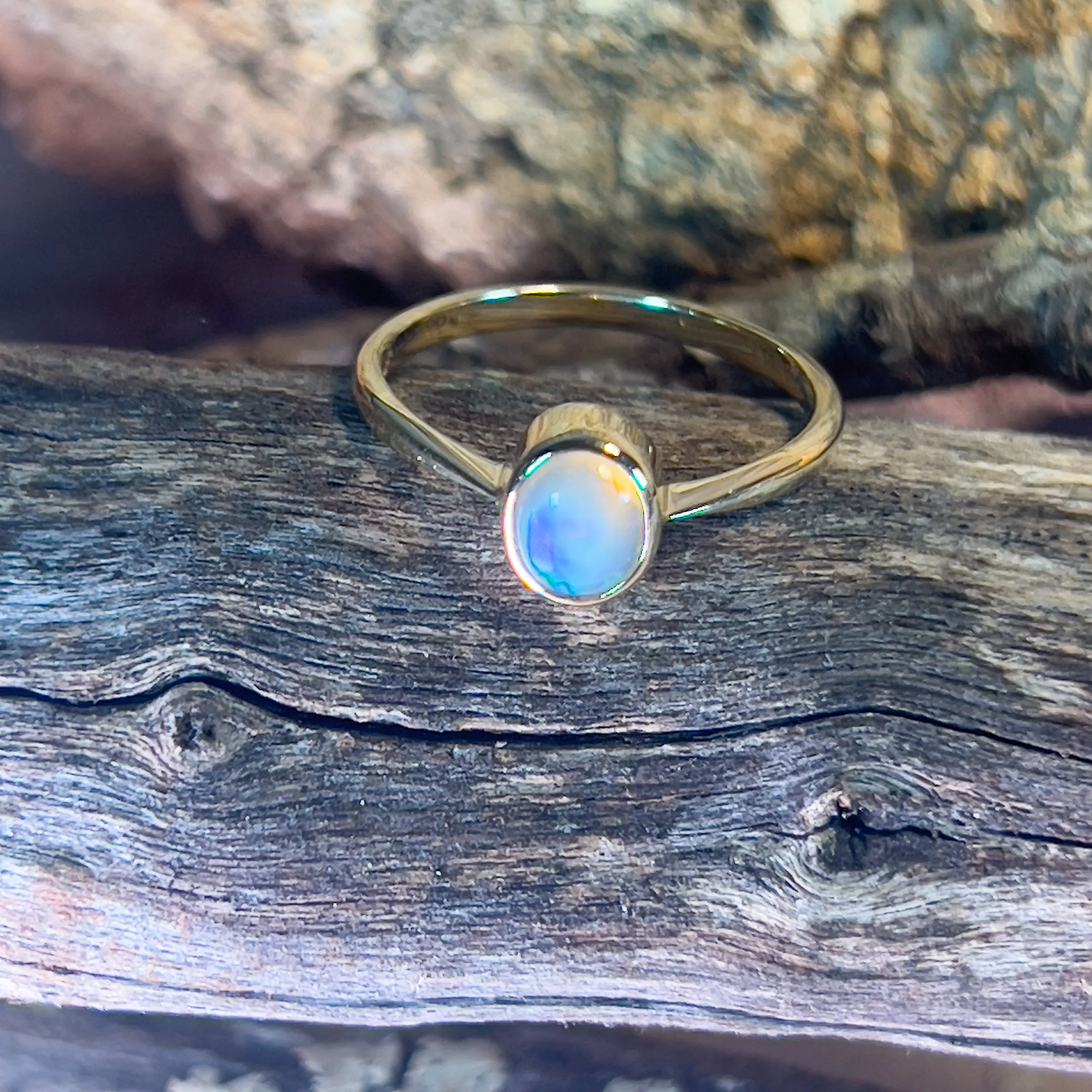 14kt Yellow Gold Black Opal 0.5ct bezel set solitaire ring